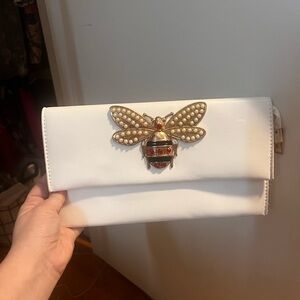 Elegant White Clutch with Gold Bee Accent